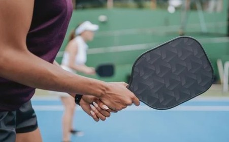 Team playing pickball